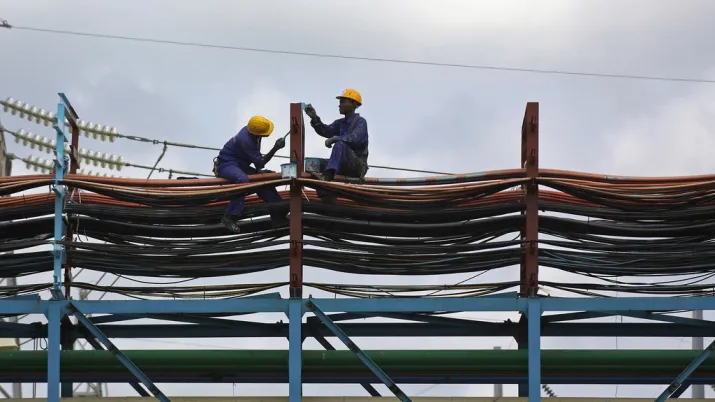 Workers maintain the thermal power station at Takoradi, Ghana