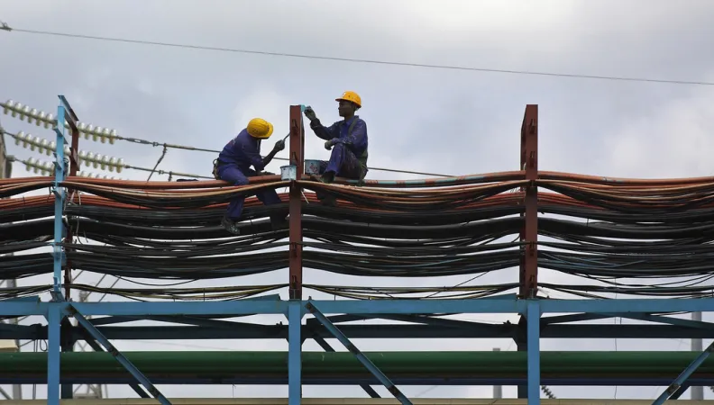 Workers maintain the thermal power station at Takoradi, Ghana