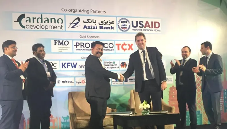 Thomas Eloy, Proparco’s Global Head of Lending Operations, and Dibyajyoti Pattanaik, Director of Annapurna, sign an agreement for a  USD 15 million credit line, during Afiforum 2020
